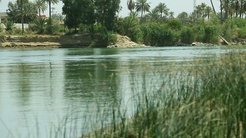 Tilt down to Euphrates river at Karbala, Iraq. The Euphrates is the longest and one of the most historically important rivers of Western Asia.