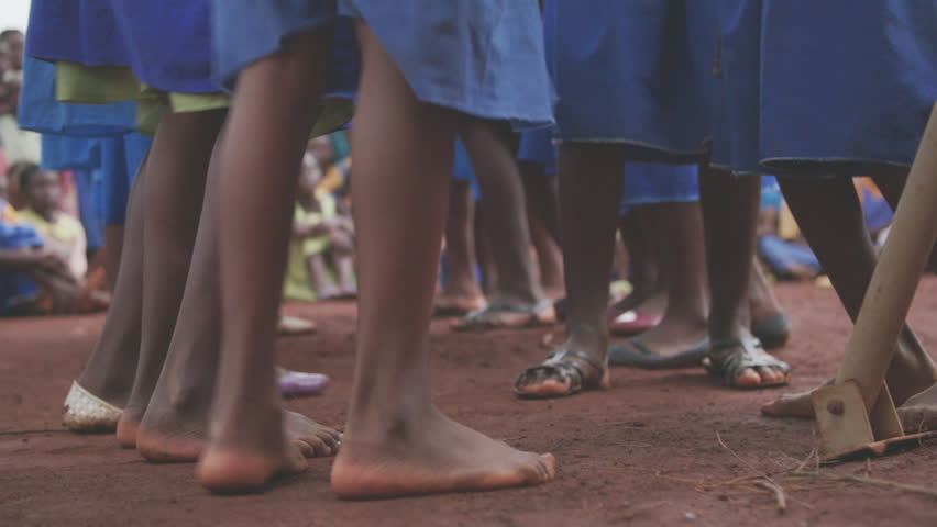 Malawi - November 2016: Feet of school children dancing to music