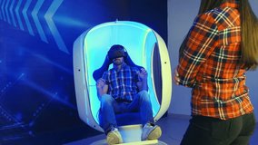 Young woman waiting for her turn for virtual reality attraction