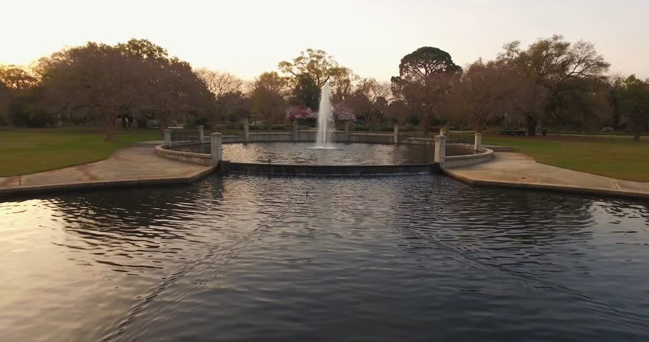 Elegant pond with fountain in a park in Charleston.