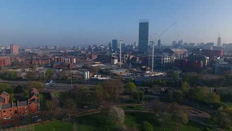 Slow drifting aerial view of Manchester city centre, UK.