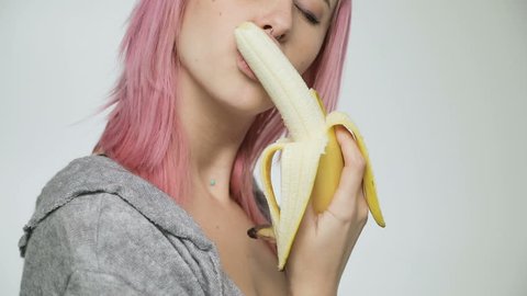 Woman lick and Eating Banana