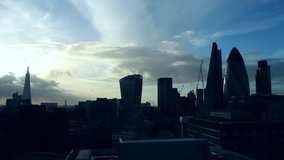 A video of sunset over the City of London, shot from East London showing the Shard, Walk-ie Talkie, Gherkin with clouds and contrails. 
