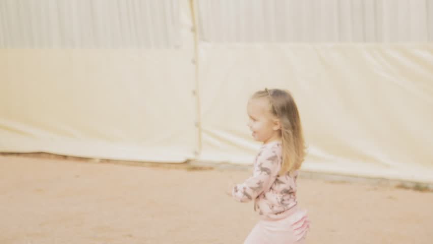 Little girl running to her mother