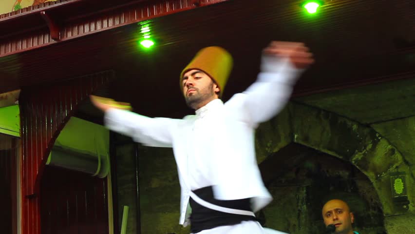 ISTANBUL - JULY 25: Sufi whirling dervish (Semazen) dances at Sultanahmet during