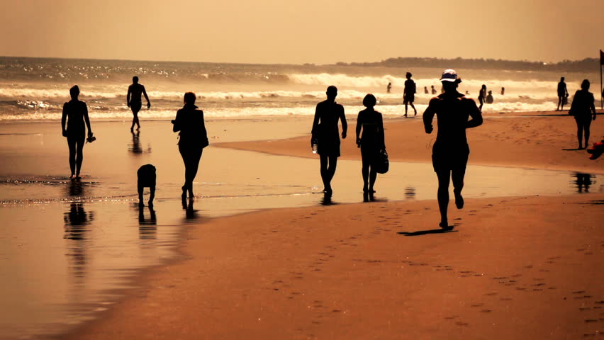 Silhouette of man jogging on beach, super slow motion 240fps
