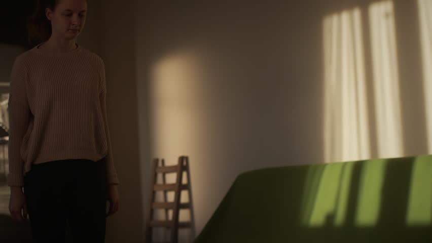 Young cheerful woman raising hands. Fitness at home at the morning. Slowmotion