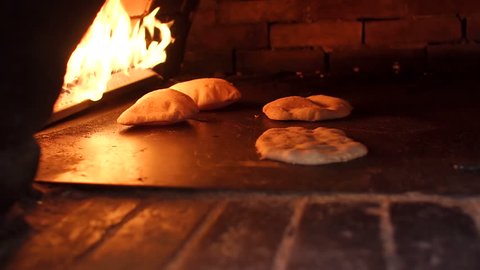 Pita baking process in the oven. Pita bread in oven. Preparation of bread.
