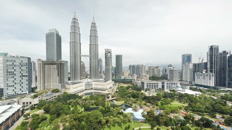 KUALA LUMPAR - CIRCA MAY 2011: View of the Petronas Twin Towers and KLCC Park, in the daytime