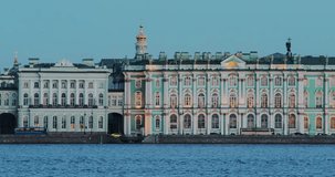Russia, Saint-Petersburg, 30 March 2017: 4K video of The Hermitage building at evening, Admiralty, Palace embankment, night illumination, slog, traffic car, a spire, a tower, cross, Alexander column