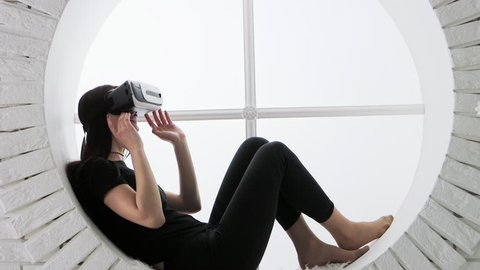 Young Woman in Virtual Reality Glasses. VR. Google cardboard. VR. Google cardboard