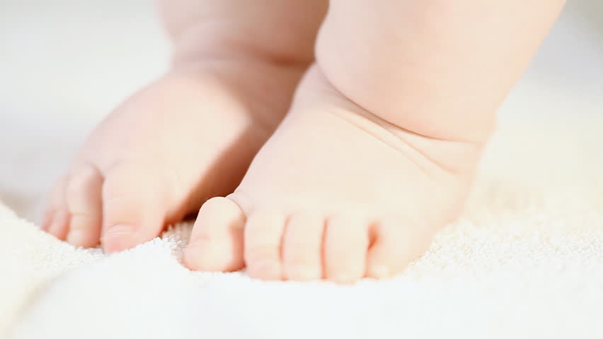 Baby foots on the light background