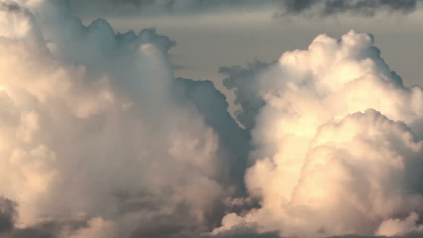 Formation of large cumulonimbus clouds at sunset. Close-up until sundown. Royalty-Free Stock Footage #2586470