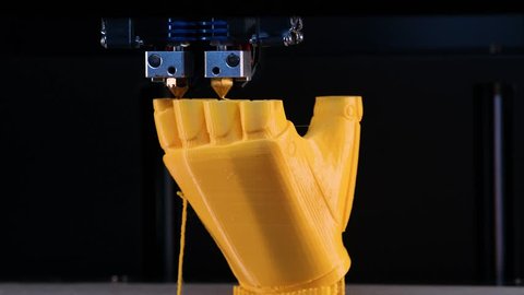3d printer prints the model of the hand, the process of printing the hand prosthesis on the 3d printer. Accelerated video.  4k footage.
