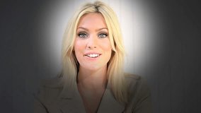 Portrait of young blonde Caucasian American businesswoman using futuristic video chat online technology in business office boardroom - Powered by Shutterstock - Get 15% off with code: PIKWIZARD15