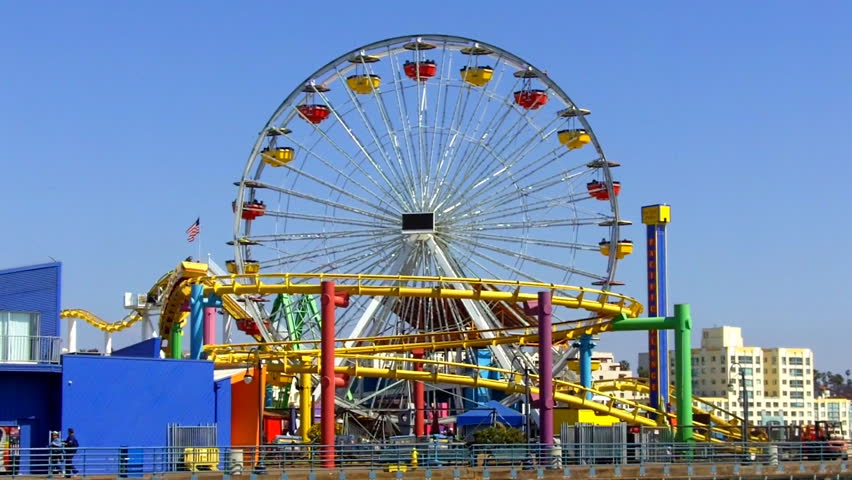 The Ferris Wheel and Roller Coaster on Santa Monica Pier in Santa Monica, CA are