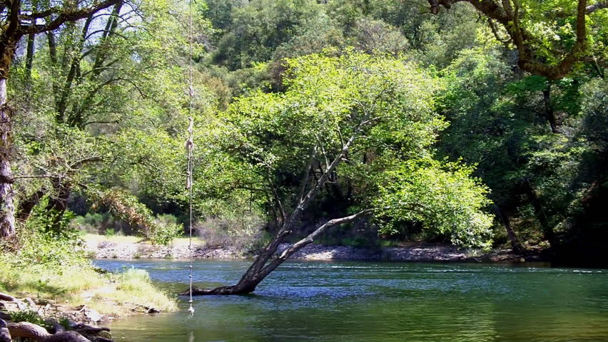 A peaceful section of the Mokelumne River near San Andreas, CA in spring with a