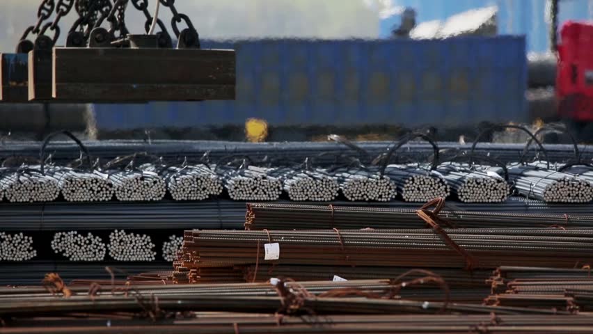 industrial magnet loading steel bars by the railway m/s Royalty-Free Stock Footage #25887875