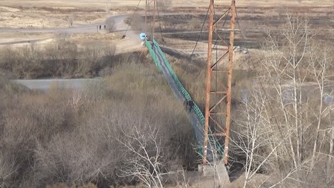 Suspension bridge over the river, top view, Russia, Siberia, Buryatia
