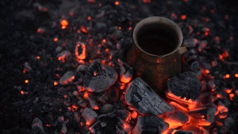 Traditional process boil Turkish coffee on coals.