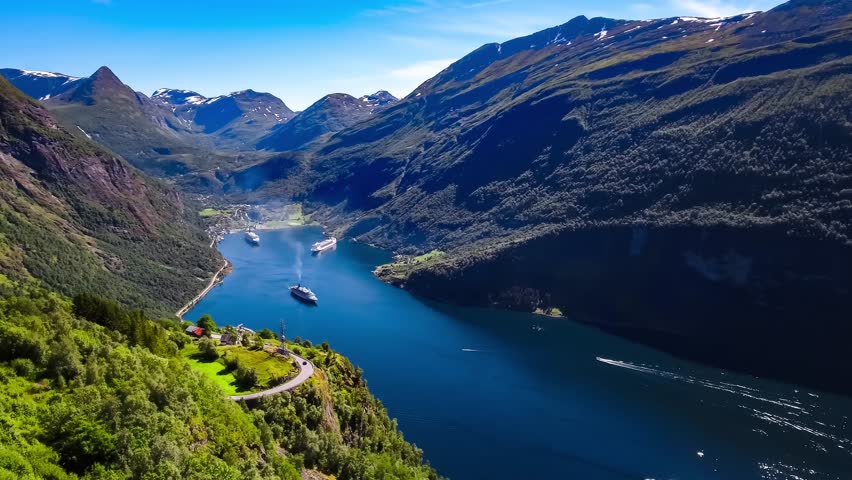 Geiranger fjord, Beautiful Nature Norway Aerial footage. It is a 15-kilometre (9.3 mi) long branch off of the Sunnylvsfjorden, which is a branch off of the Storfjorden (Great Fjord). Royalty-Free Stock Footage #25915937