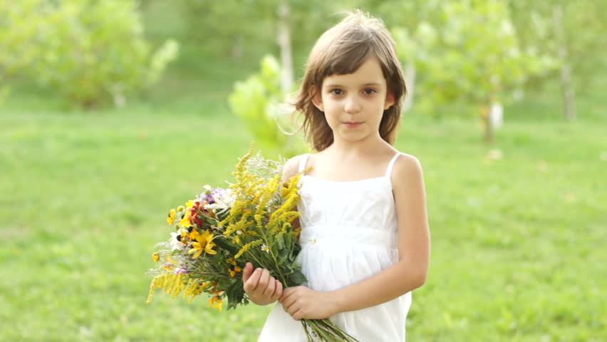 Girl with a bouquet of flowers spinning
