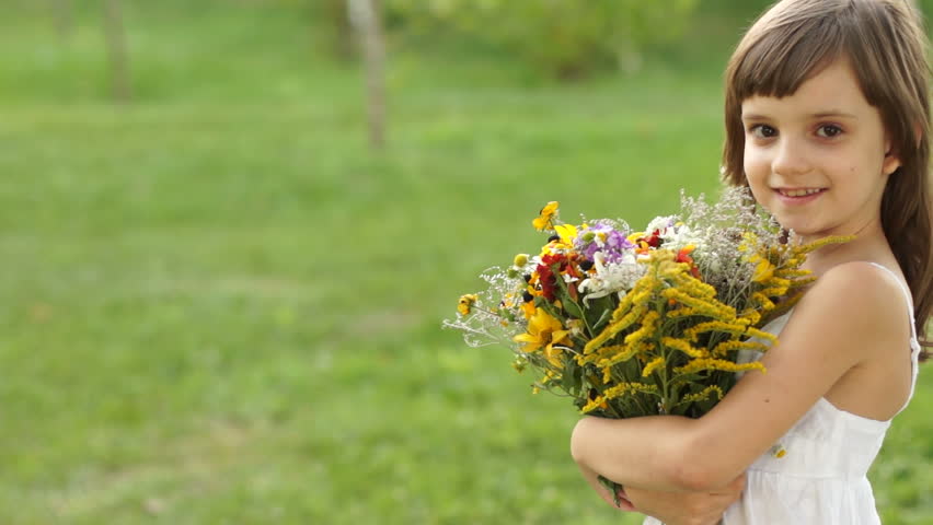 Portrait of girl with a bouquet of flowers
