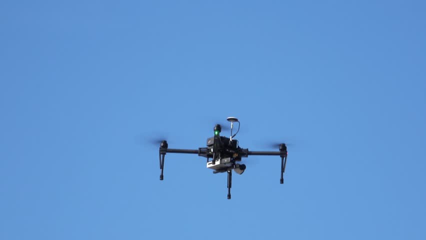 Drone flying in the blue sky