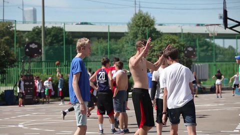 MOSCOW, RUSSIA - JULY 25, 2015: Boys playing outdoor street basketball tournament 3x3