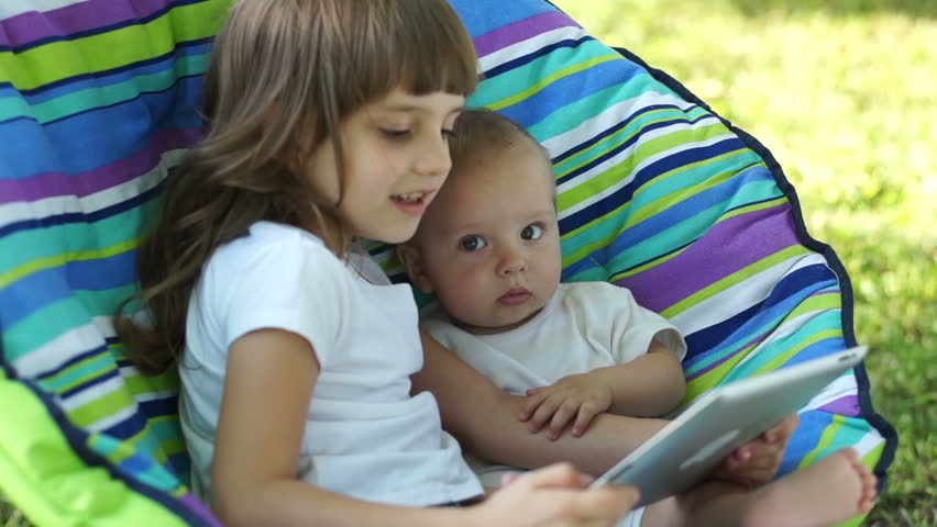 Children with a Tablet PC outdoors