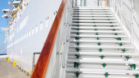 steps leading to an entrance in big passenger ship in port
