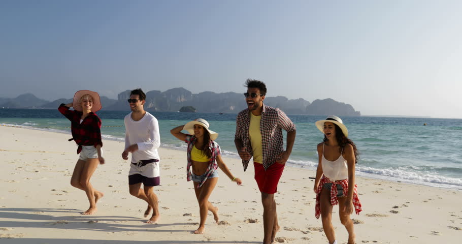 Happy People Running From Water On Beach, Mix Race Man And Woman Group Tourists Happy Smiling Slow Motion 60 | Shutterstock HD Video #25930109