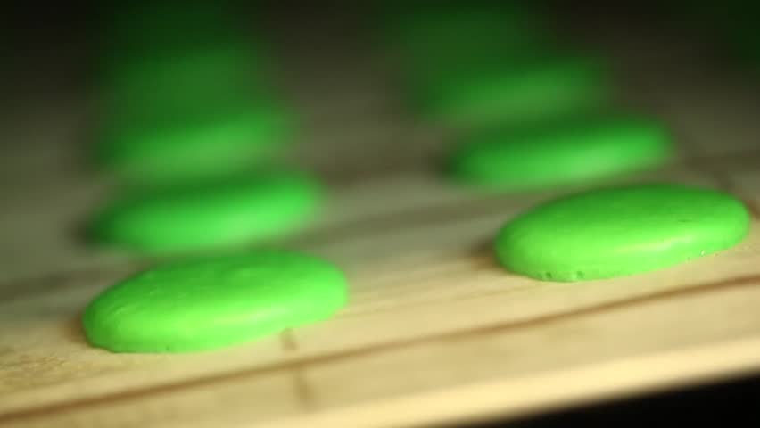 Time lapse of green macaroons baking