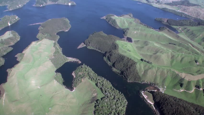 Forest in landscape of river and lake view from above in New Zealand. Travel and tourism in the world of wildlife.