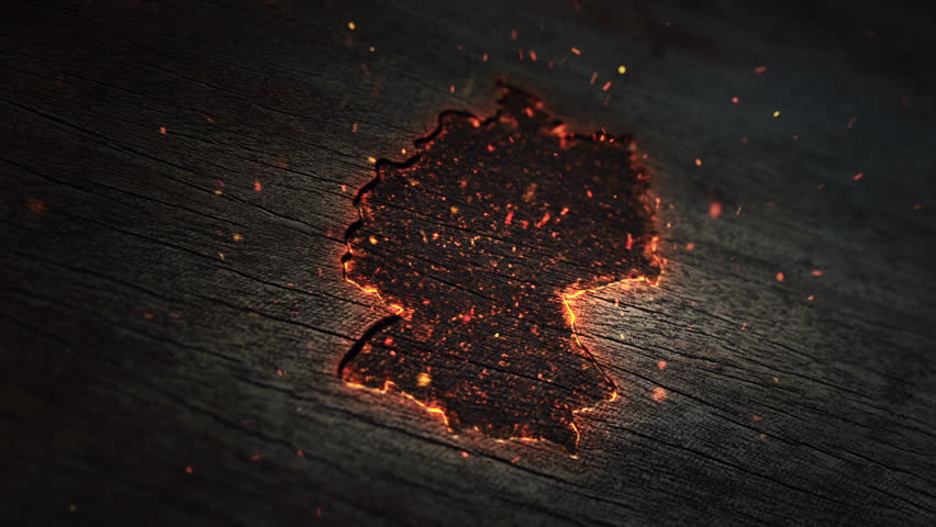 Abstract background with silhouette map of Germany on burning wooden surface and flying particles from fire. Animation of seamless loop.