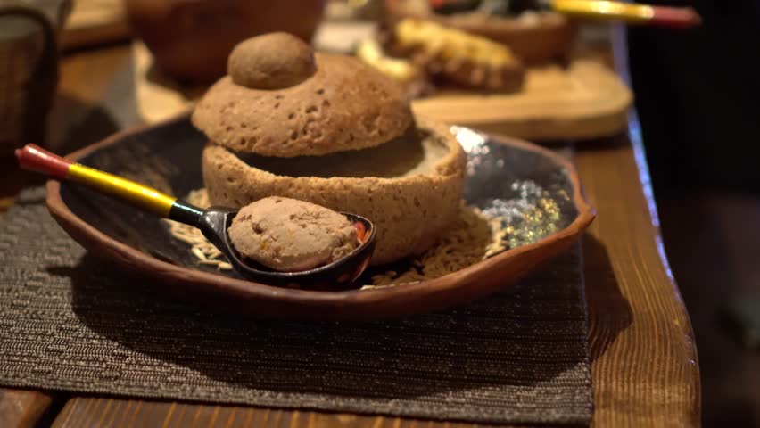 Traditional Russian food. Restraint table macro meal. Soup in bred pot. Quality gimbal movement.