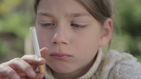 Portrait of a boy with a cigarette in his hand. Anti tobacco video. For a healthy lifestyle. 