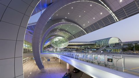 DUBAI, UNITED ARAB EMIRATES - CIRCA MAY 2011: People arriving and departing from Dubai International Airport with a Futuristic Modern Design