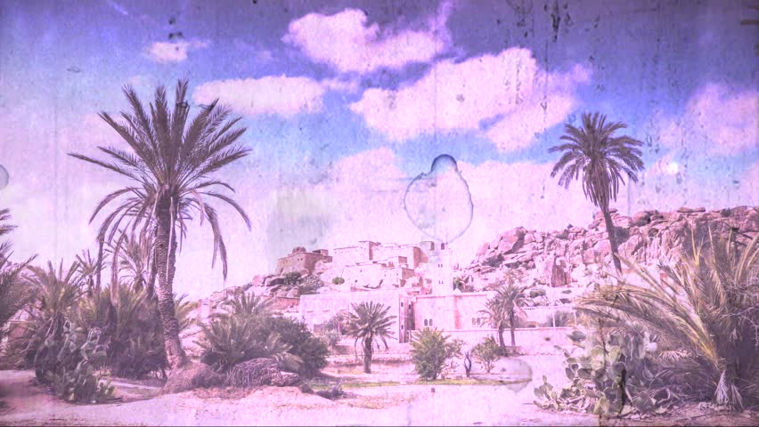 Vintage, wide shot, time-lapse of traditional Berber village in the Ameln Valley of the Anti-Atlas mountains in Morocco.
