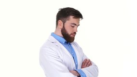 Young cheerful doctor man looking camera and showing thumb up isolated 