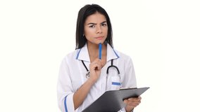 Inattentive woman nurse listening and writing information to folder isolated