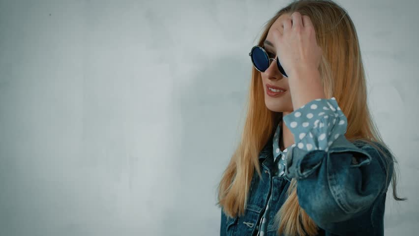 Girl in glasses posing