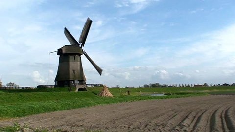 Windmill turning in a field