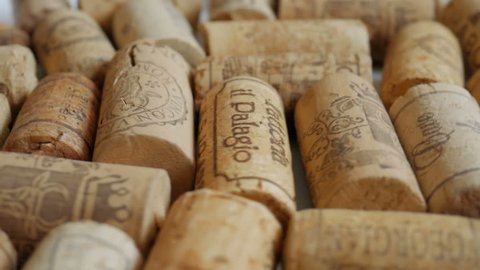ODESSA, UKRAINE - MARCH 12, 2017: Wine corks rotates as a background. Video in slow motion of multinational corking products with shallow focus