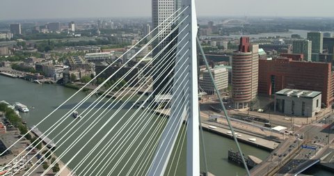 Aerial of the Erasmus Bridge in Rotterdam with some buildings on the background, Rotterdam, Netherlands.