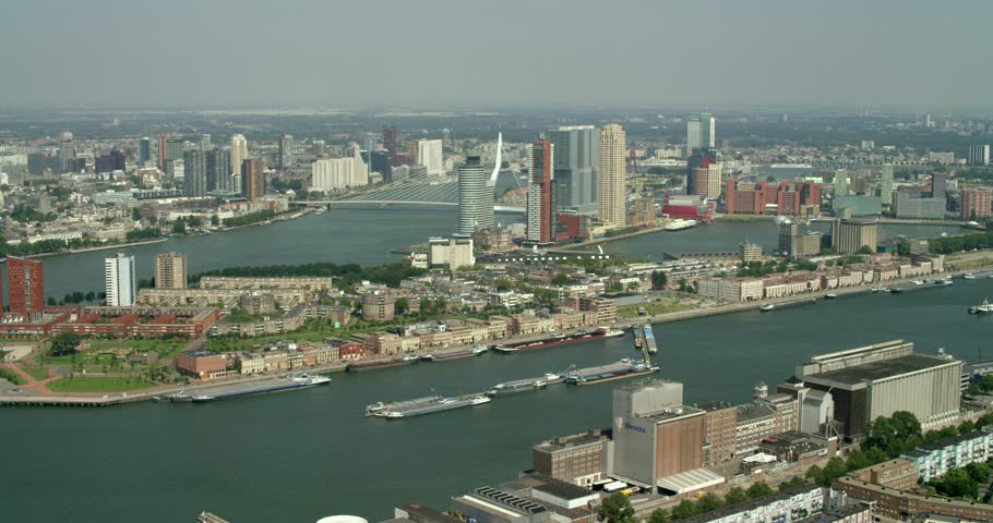 Aerial view of the iconic landmark of Rotterdam. With the Erasmusbridge and the skyline in the background. Shot on a RED Dragon. 