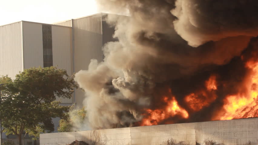 Firefighters battle blaze in packaging industrial factory fire Royalty-Free Stock Footage #25995170