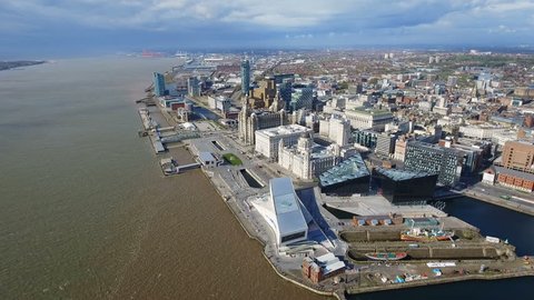 Aerial View of New Liverpool Cityscape Skyline feat. Iconic Landmarks such as Museum of Liverpool, Royal Liver and River Mersey with Modern Skyscrapers Buildings in 4K Ultra HD