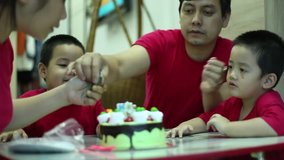 Family, cake and candle with small room ( Time for fun with cake candle ) footage