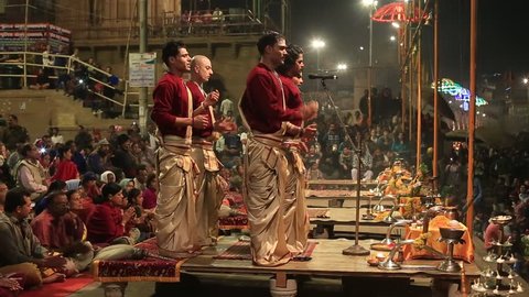 VARANASI, INDIA - JANUARY 25, 2017 : Unidentified Hindu priest at the religious Ganga Aarti ritual, fire puja, at Dashashwamedh Ghat in Varanasi, Uttar Pradesh, India